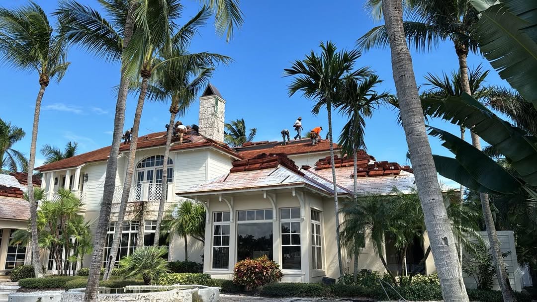 Mid-installation tile roof with crew on site